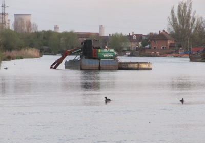 Dredging barge in the middle of the River Thames in Abingdon